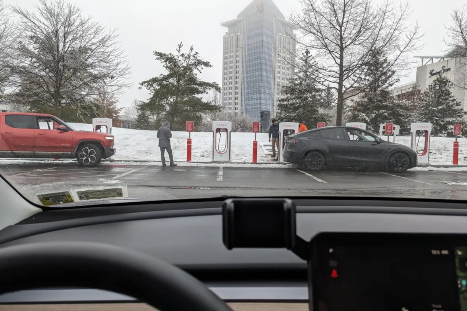 Tesla Superchargers With Magic Dock Spotted Charging A Rivian R1T