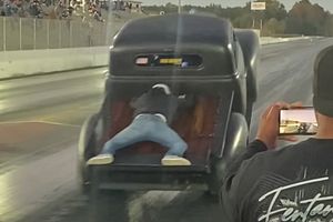 Watch: Man Goes For A Ride-Along On Drag Racing Truck's Bed