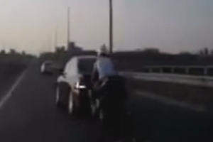 Biker Smashes Into Car, Lands Feet First Onto Roof