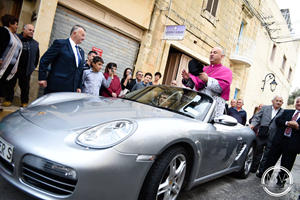 Priest Parades In Porsche Boxster Pulled By 50 Children