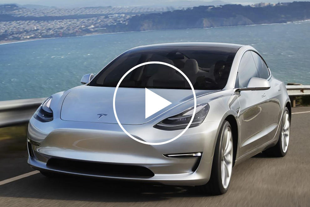 Tesla Model 3 driving fast down a road